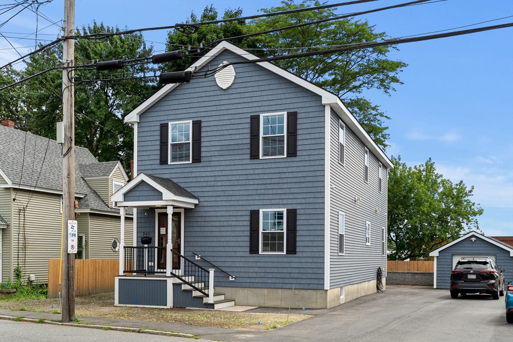 a front view of a house with garage