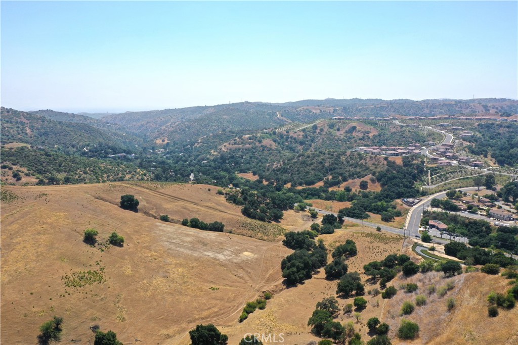 an aerial view of residential house and sandy dunes