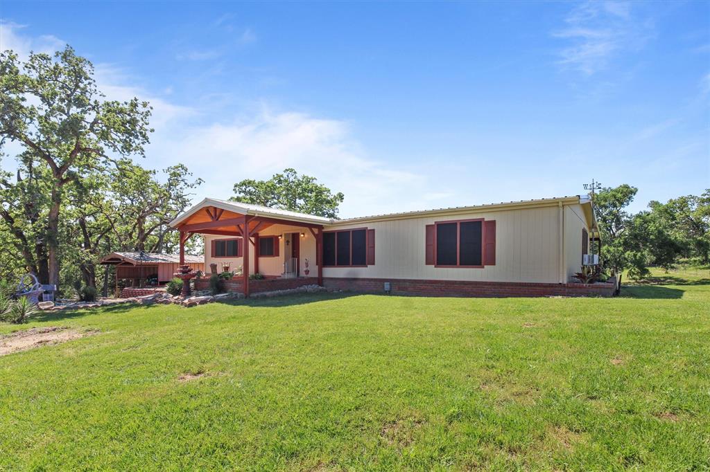 a view of a house with a big yard