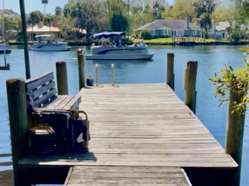 a view of a lake with sitting area