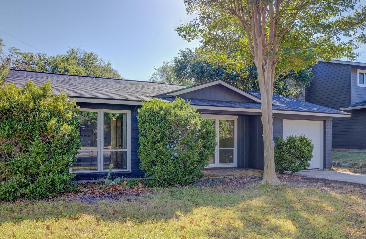 front view of a house with a yard