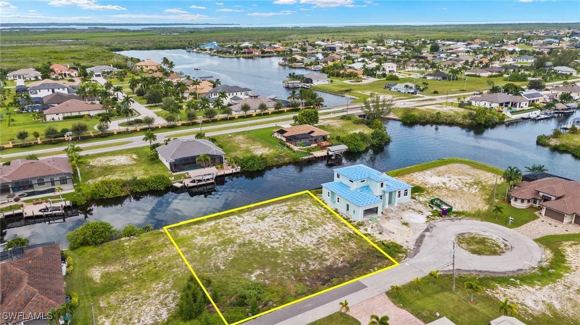 an aerial view of a house with a ocean view