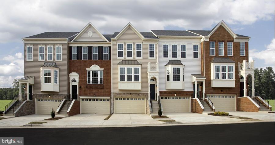 a view of multiple houses with a street