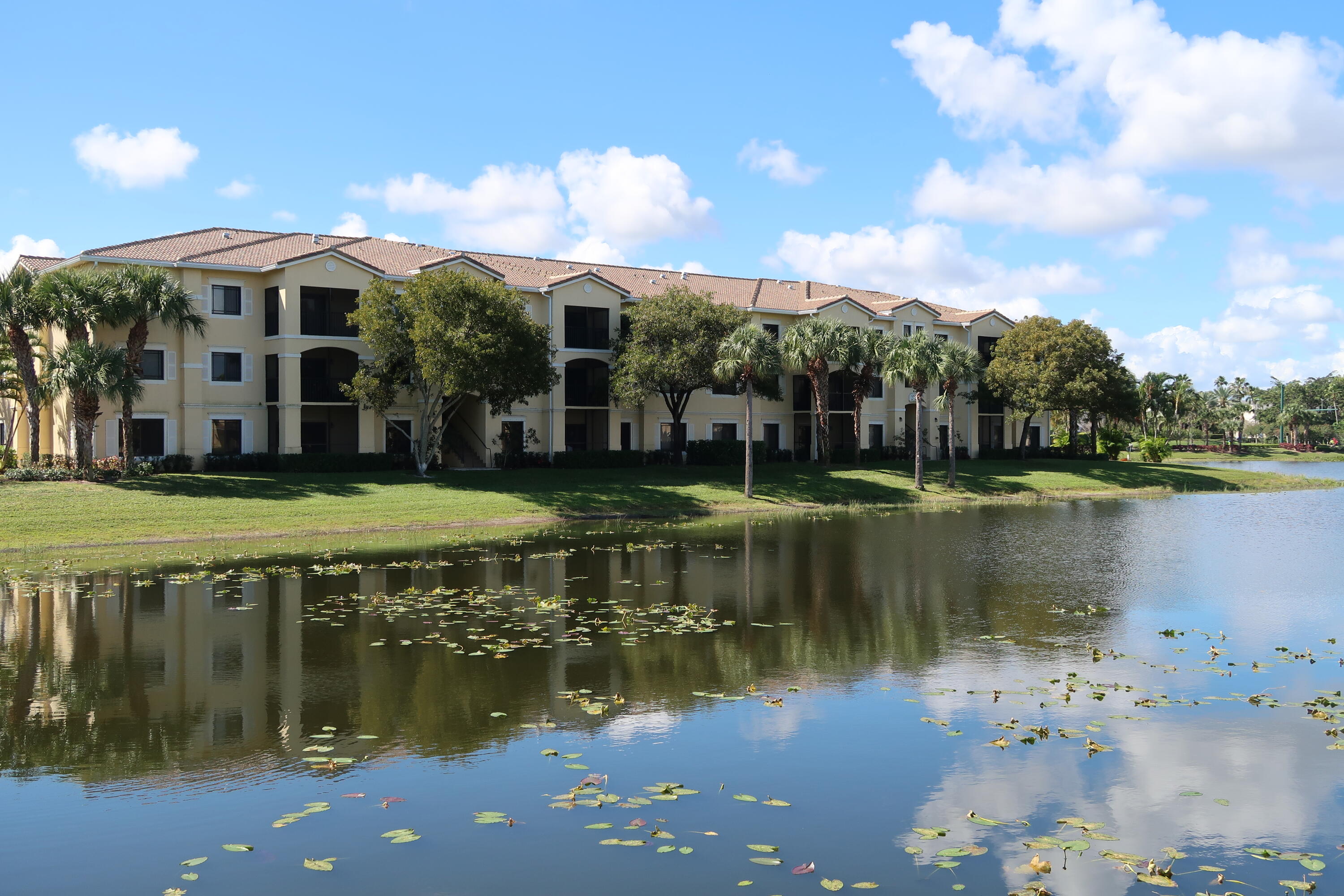 a view of a lake with a house in the background