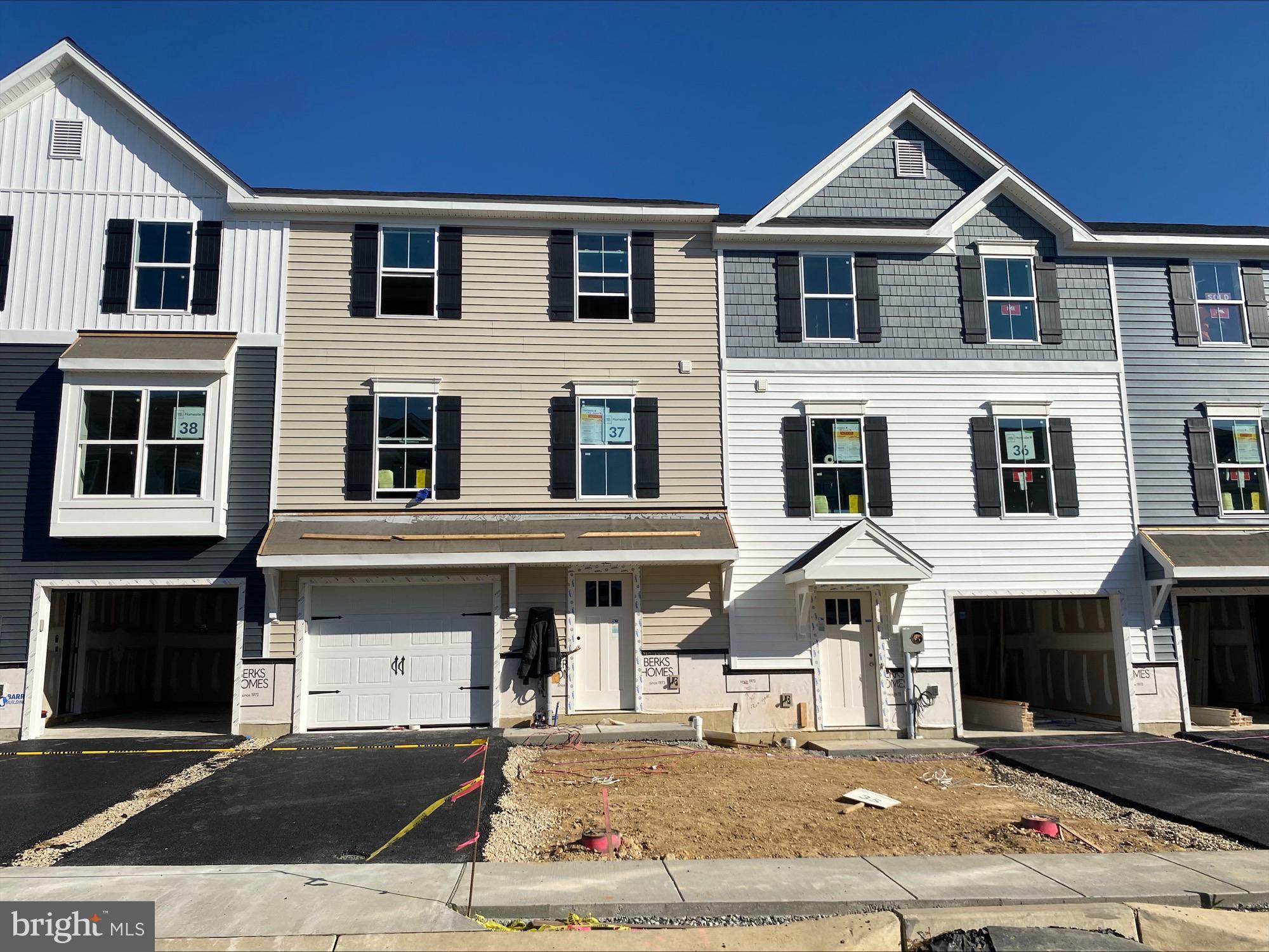 a front view of a house with yard