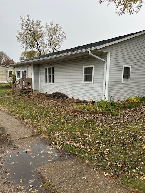 a backyard of a house with large trees