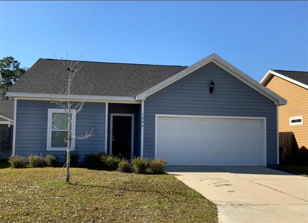 a front view of a house with garage