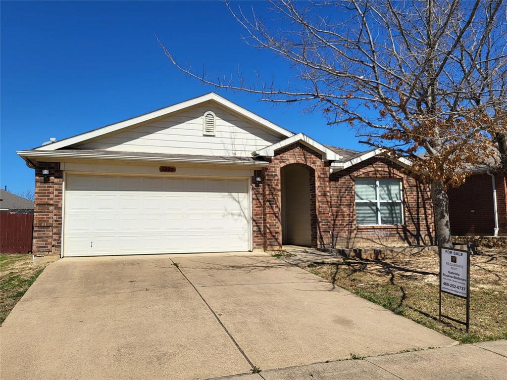 a front view of a house with yard