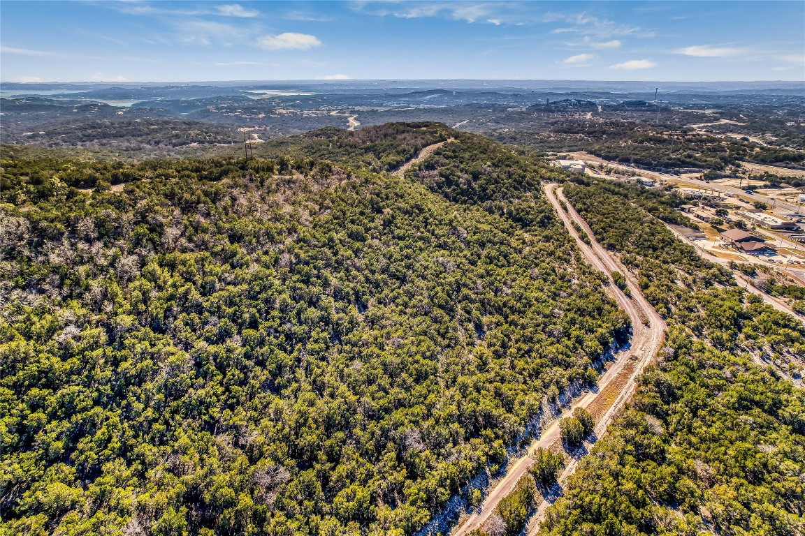 an aerial view of residential building and trees