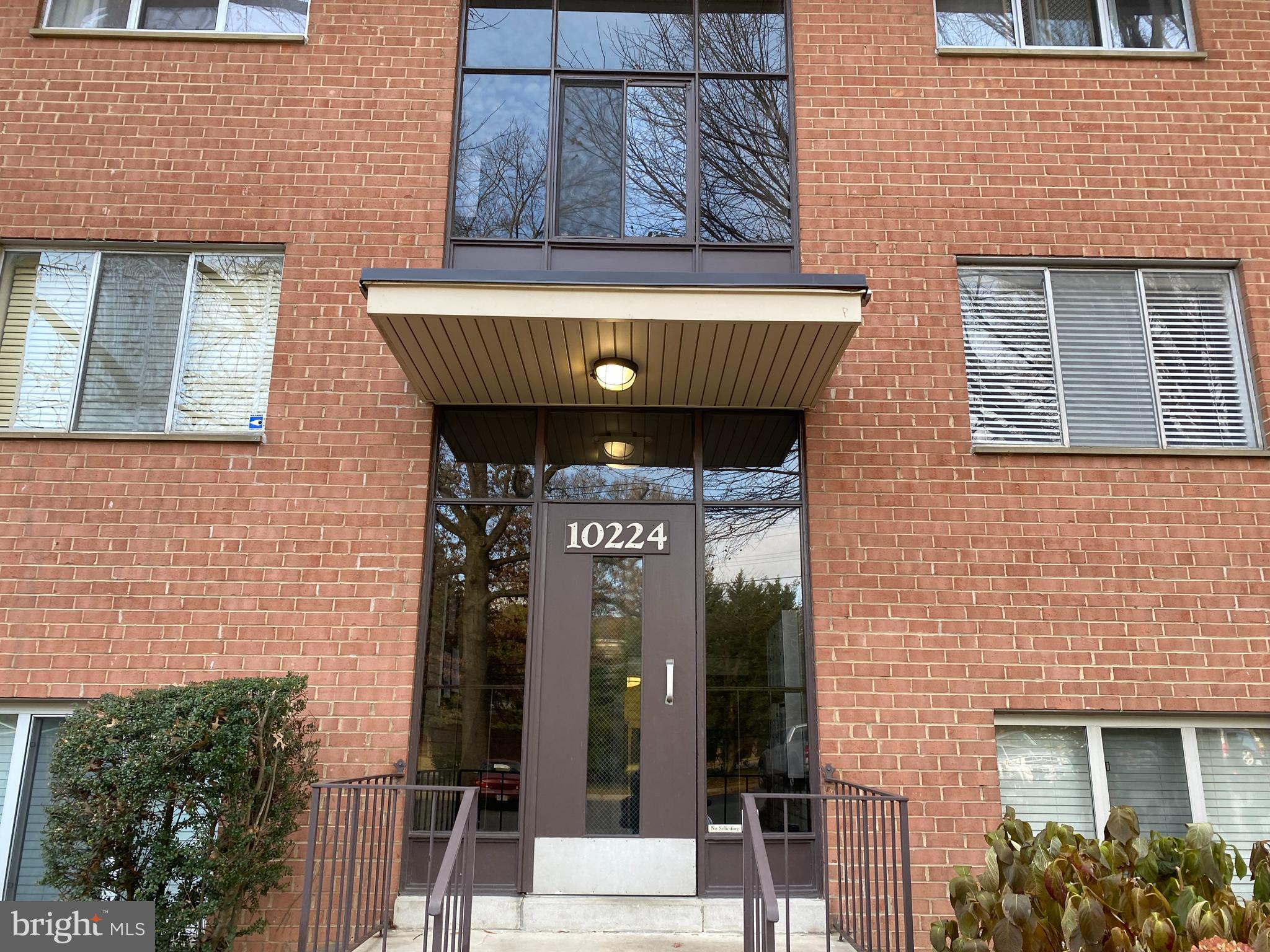 a front view of a house with glass windows