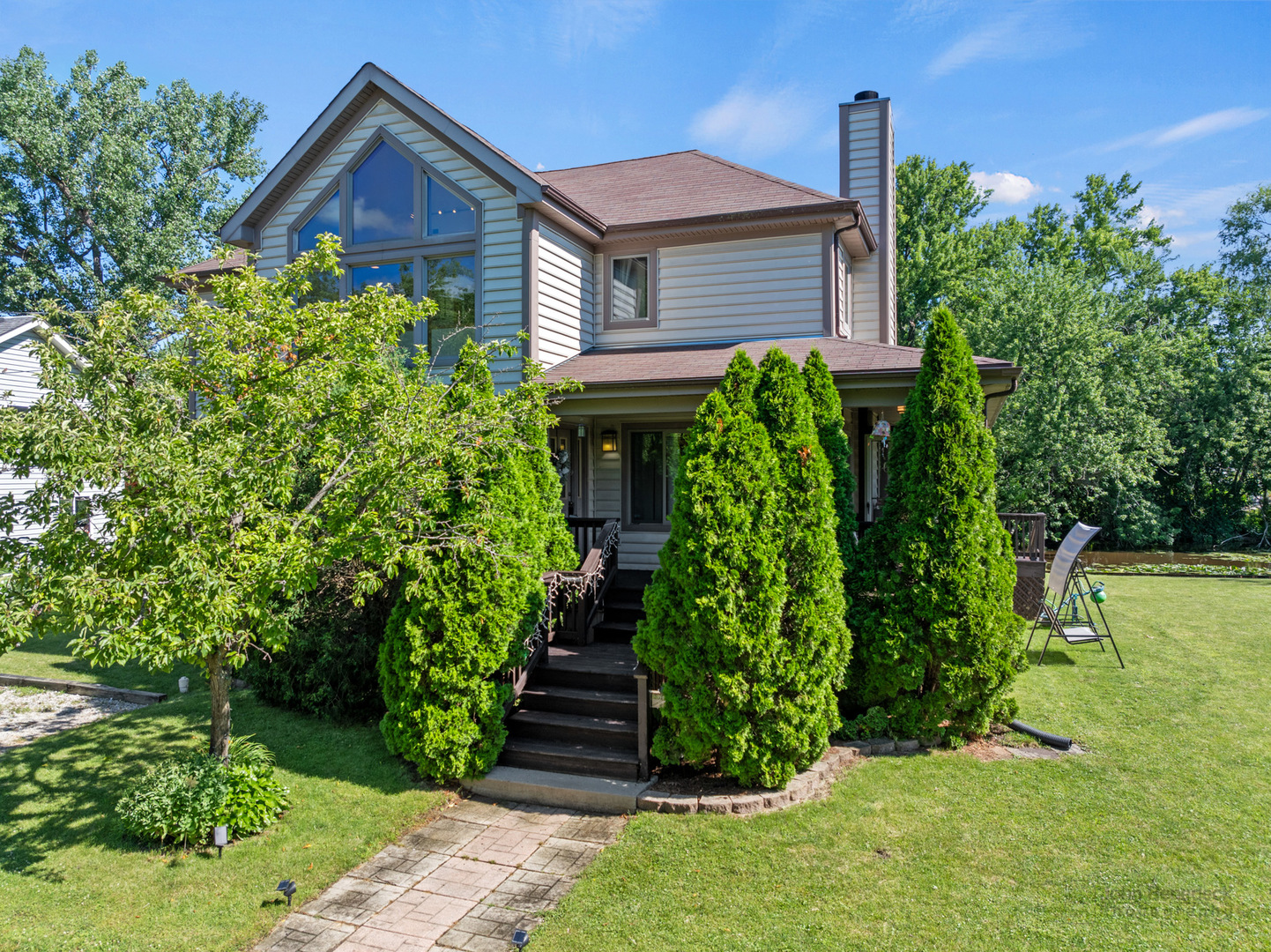 a front view of a house with a yard