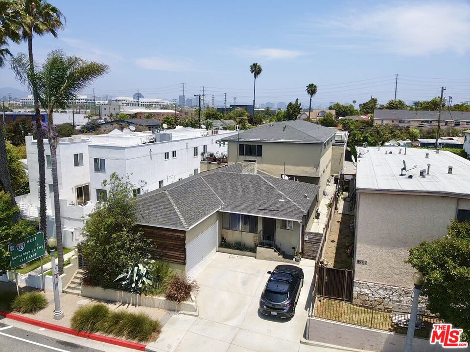 an aerial view of a house with a garden and plants