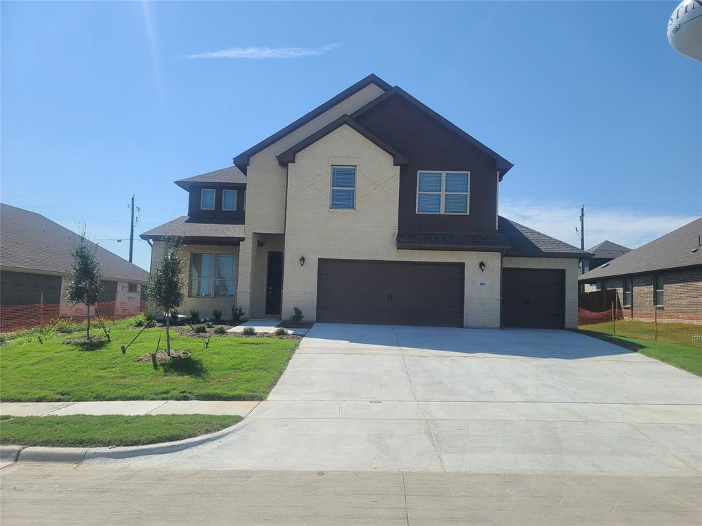 a front view of house with yard and green space