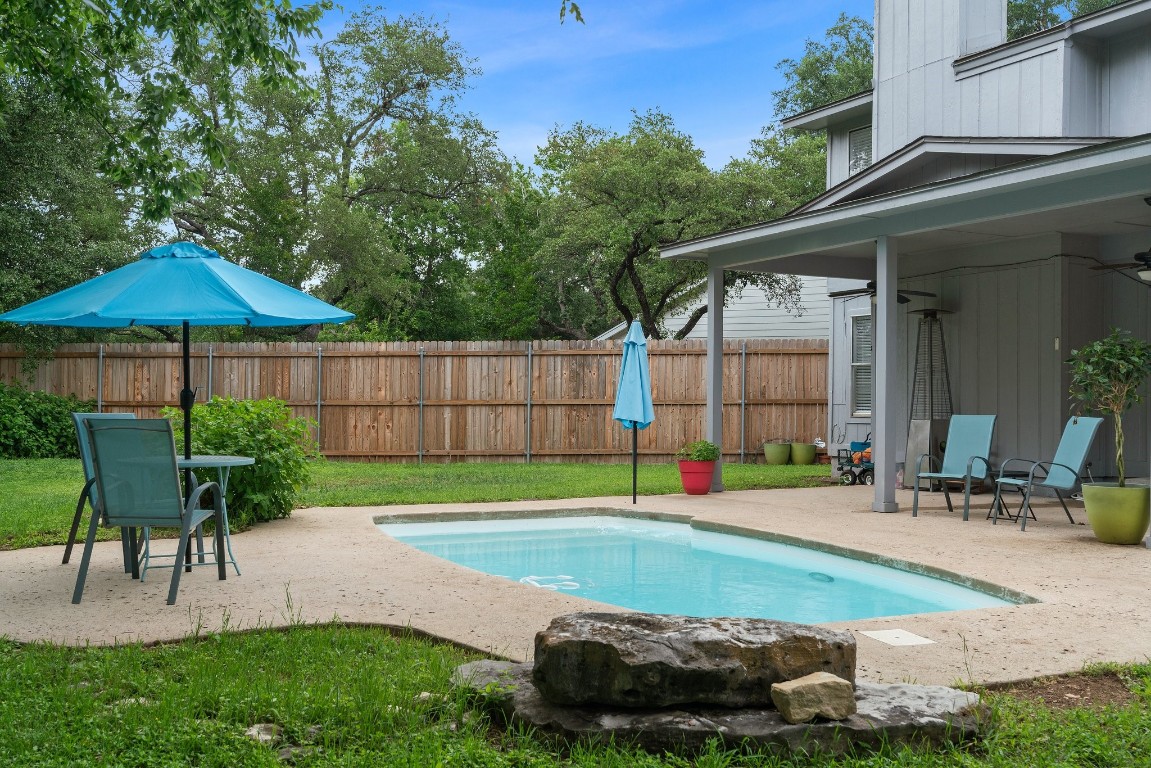 Discover endless possibilities in the expansive backyard, offering plenty of space for outdoor activities, gardening, and relaxation.
