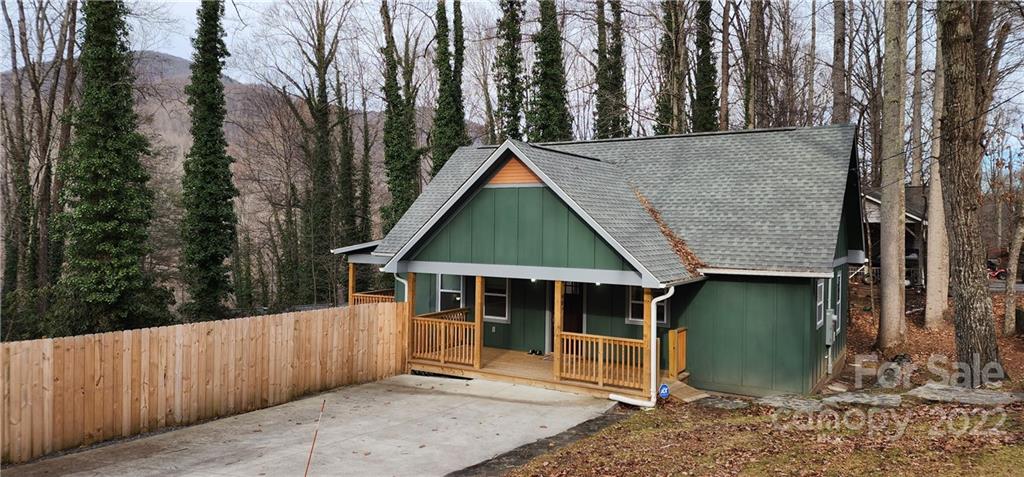 a house with trees in the background