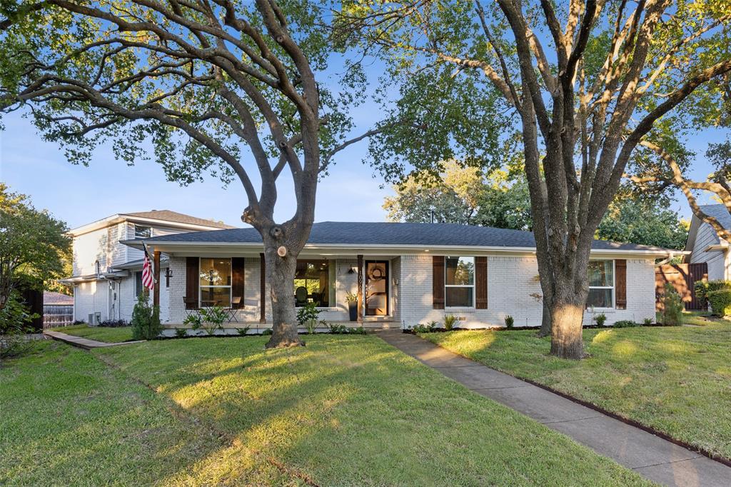 front view of a house with swimming pool and porch