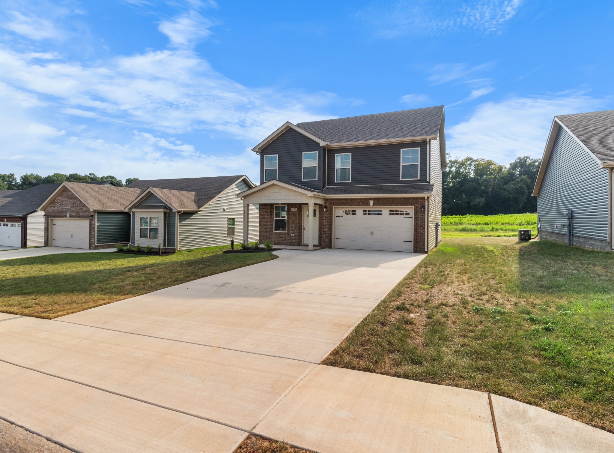 a front view of a house with a yard