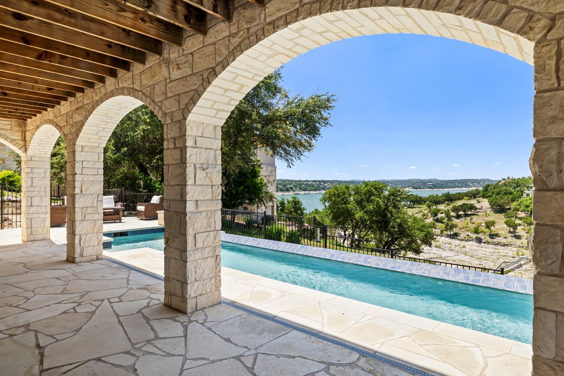 a view of swimming pool from a balcony