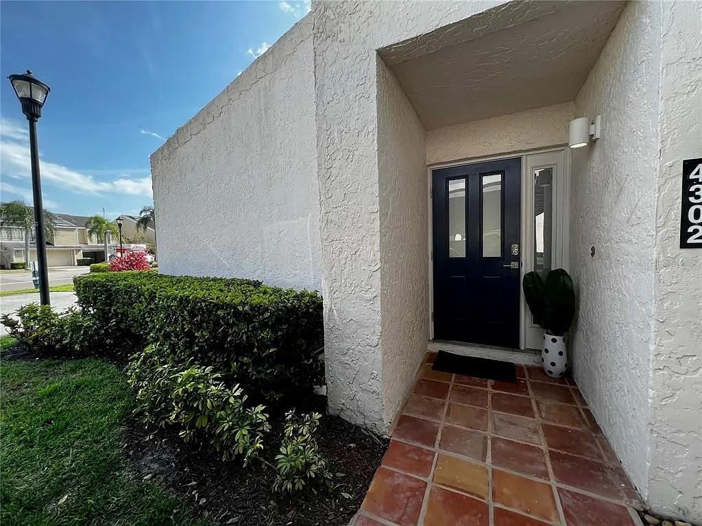 a view of a door and a window