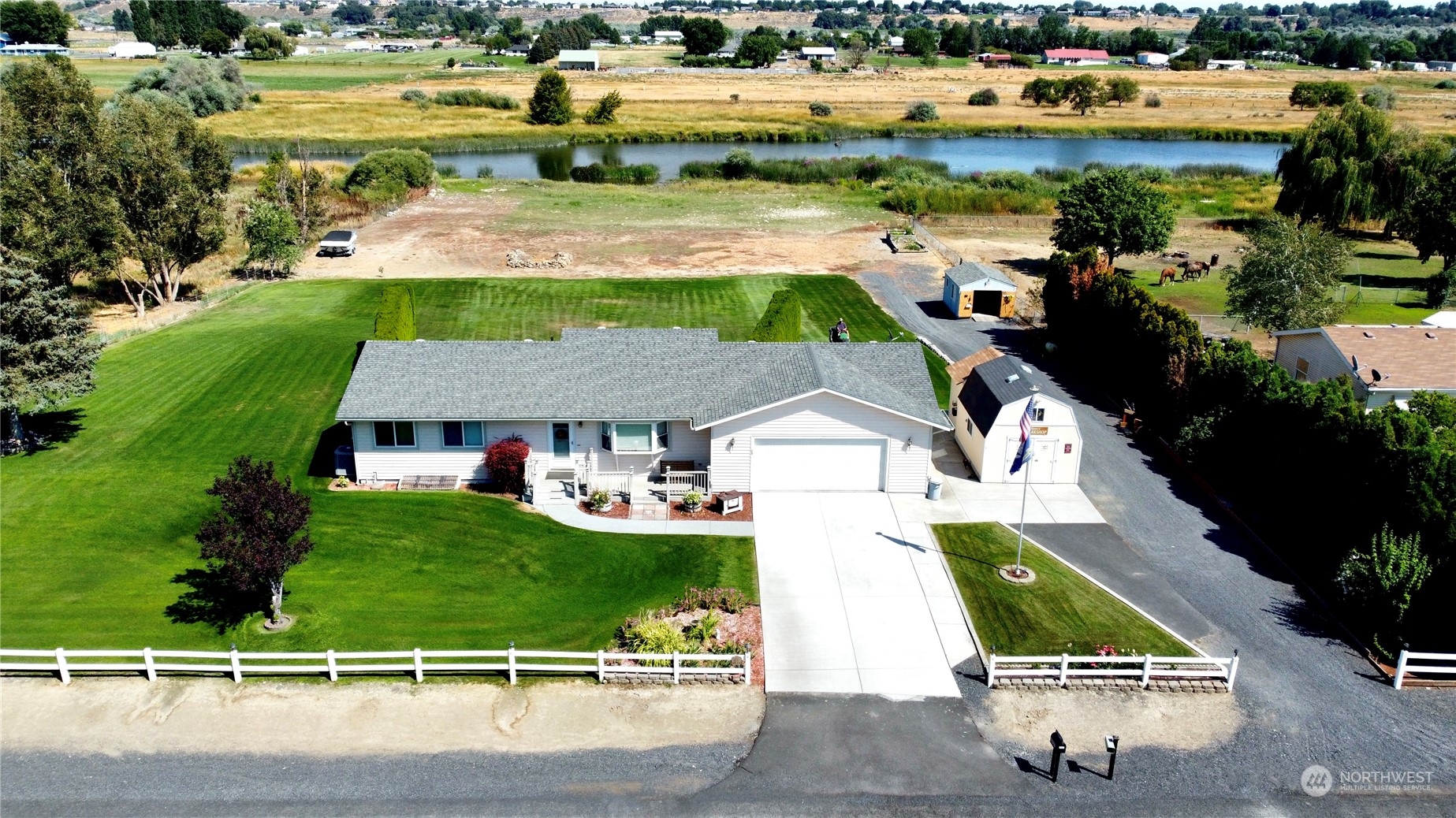 an aerial view of a house with outdoor space