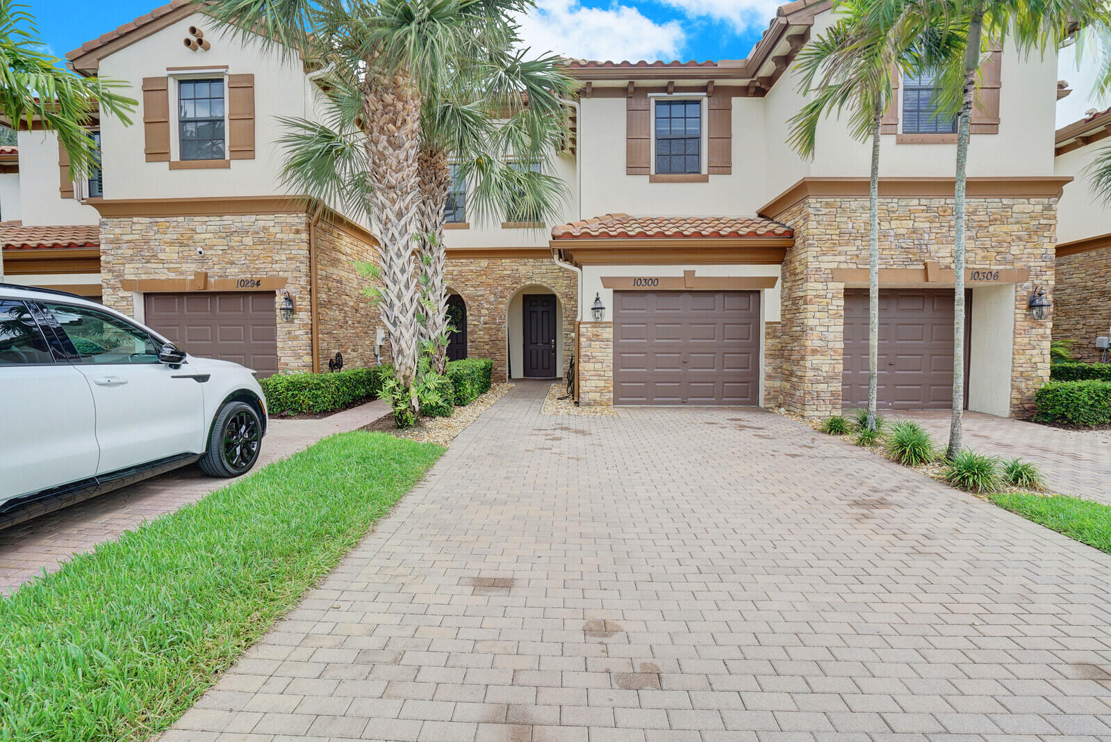 a view of a car parked in front of a house