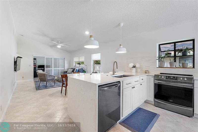 a kitchen with furniture a stove and a fireplace