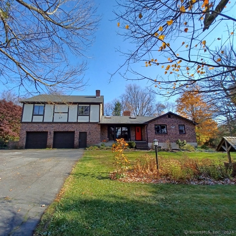 front view of a house with a big yard