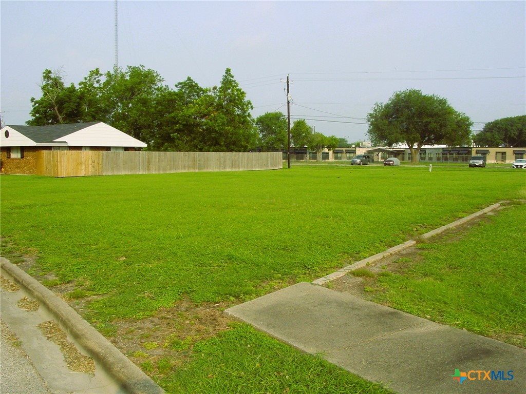 a view of green field with clear sky