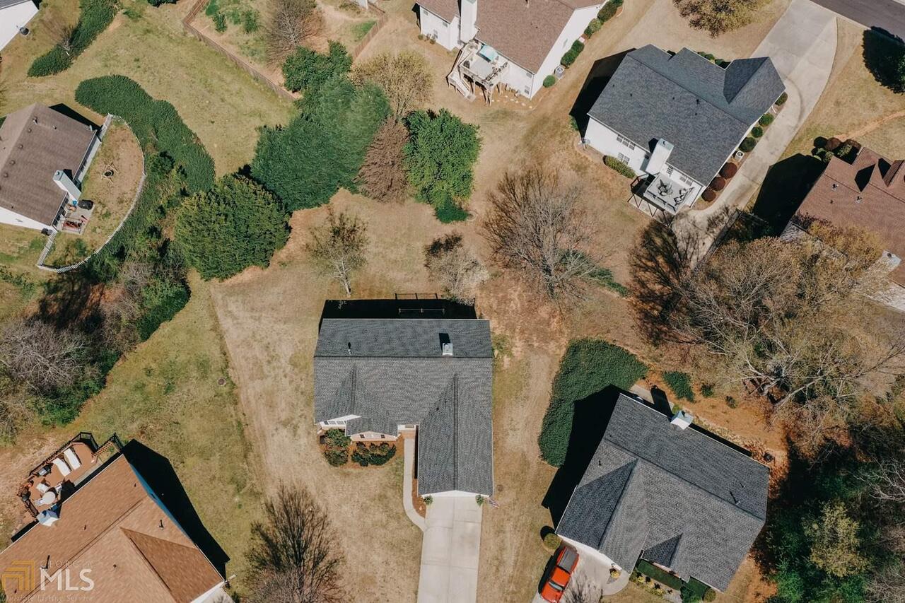 an aerial view of residential houses with outdoor space