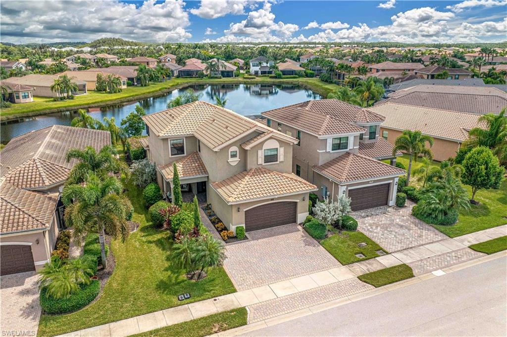 an aerial view of a house with a lake view