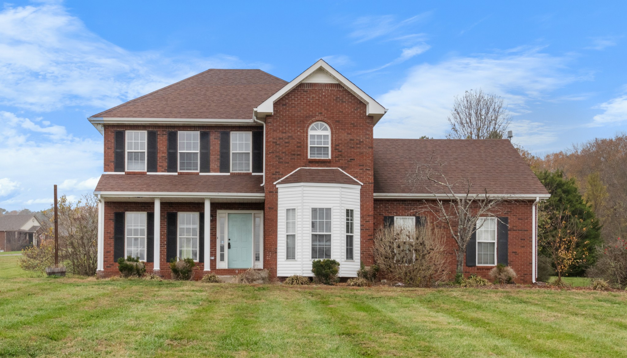 a front view of a house with a yard