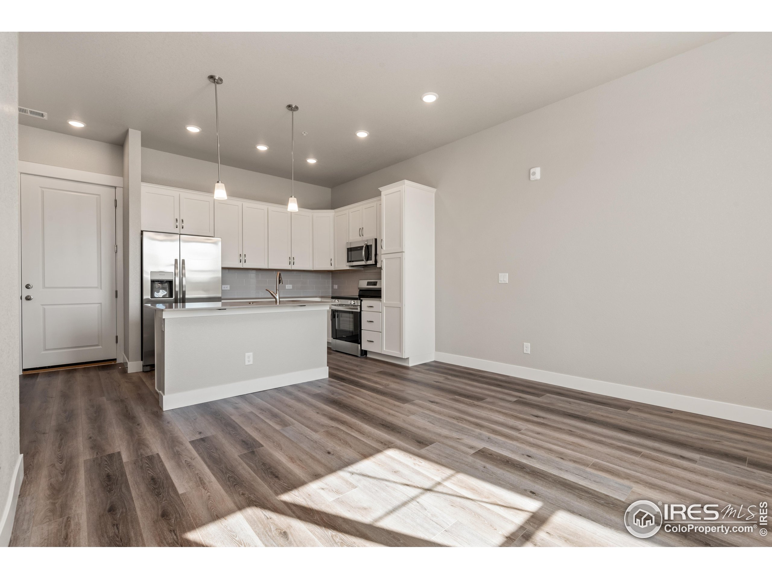 a view of kitchen kitchen microwave and cabinets