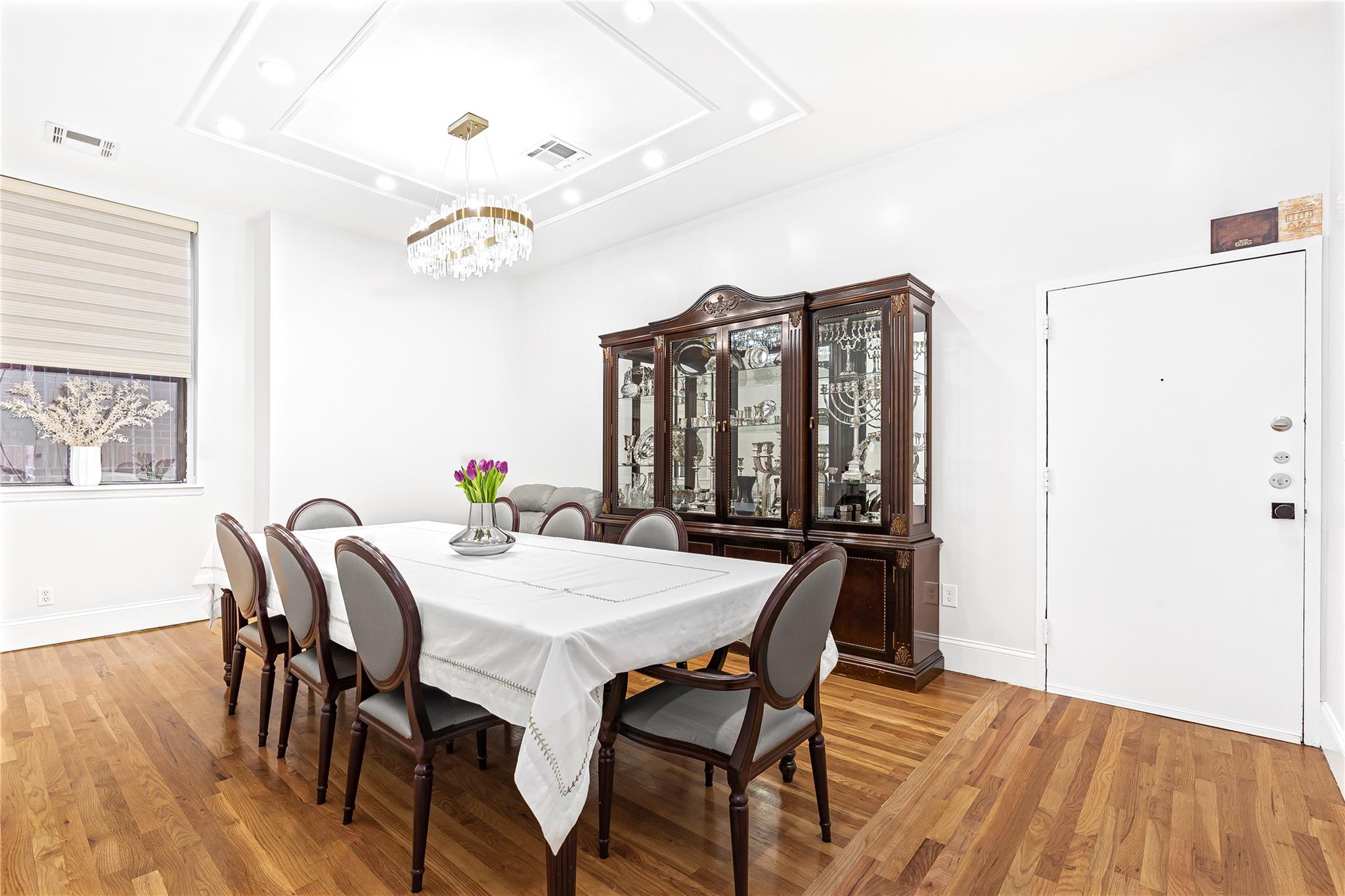 a view of a dining room with furniture and window