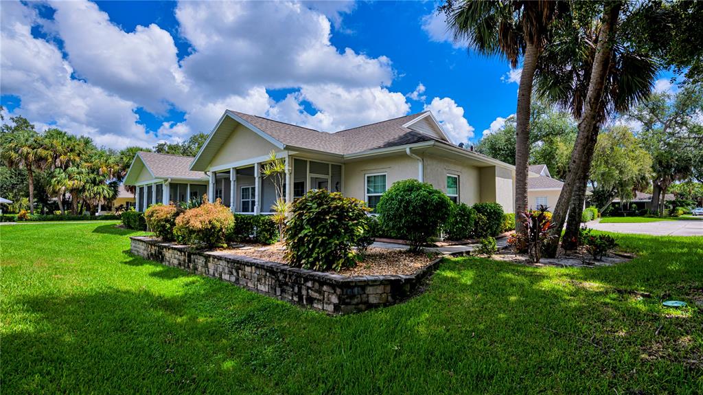 a view of a house with a yard porch and sitting area