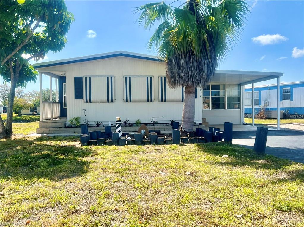 a view of a house with swimming pool and sitting area