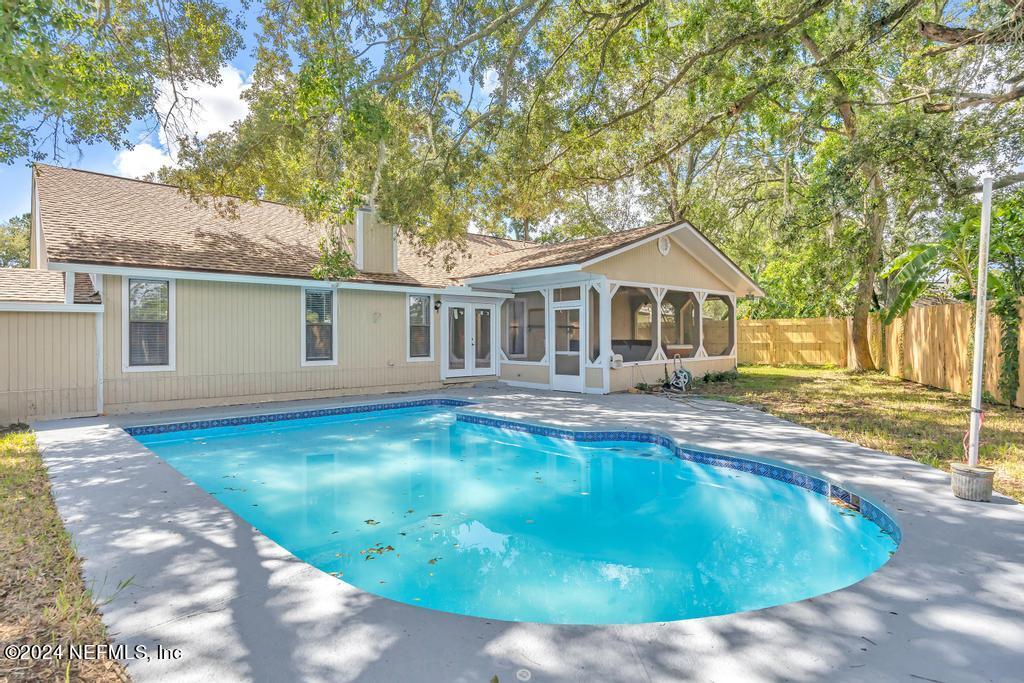 a view of a house with swimming pool