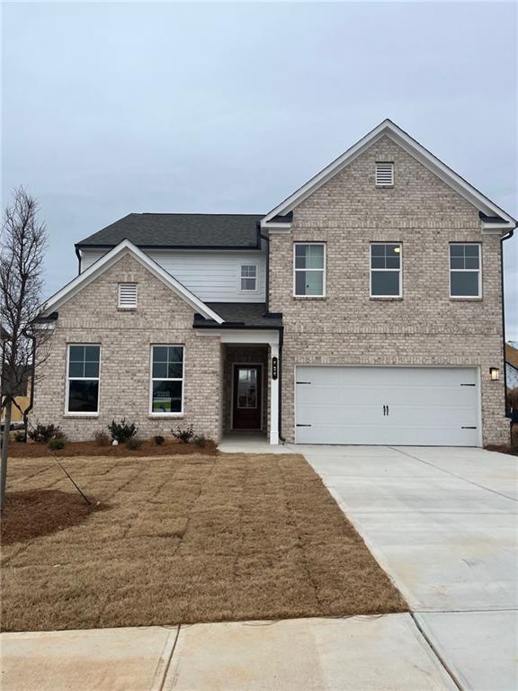 a front view of a house with yard