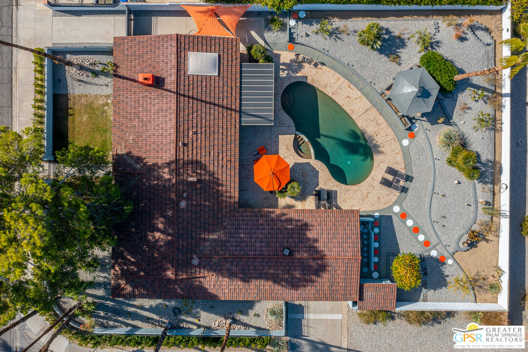 an aerial view of residential house with outdoor space and swimming pool