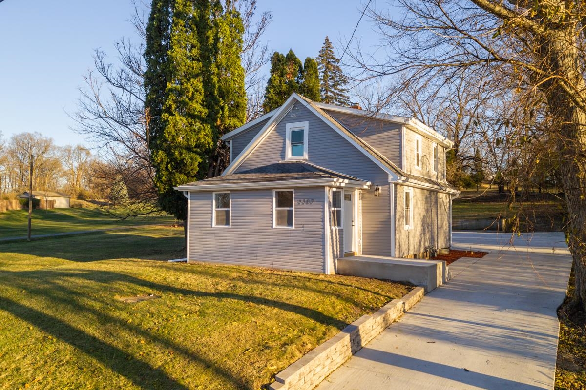 a front view of a house with yard