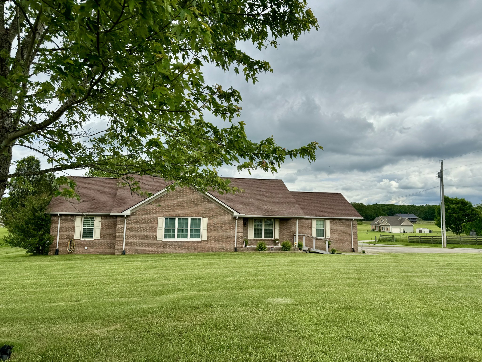 a front view of a house with a garden