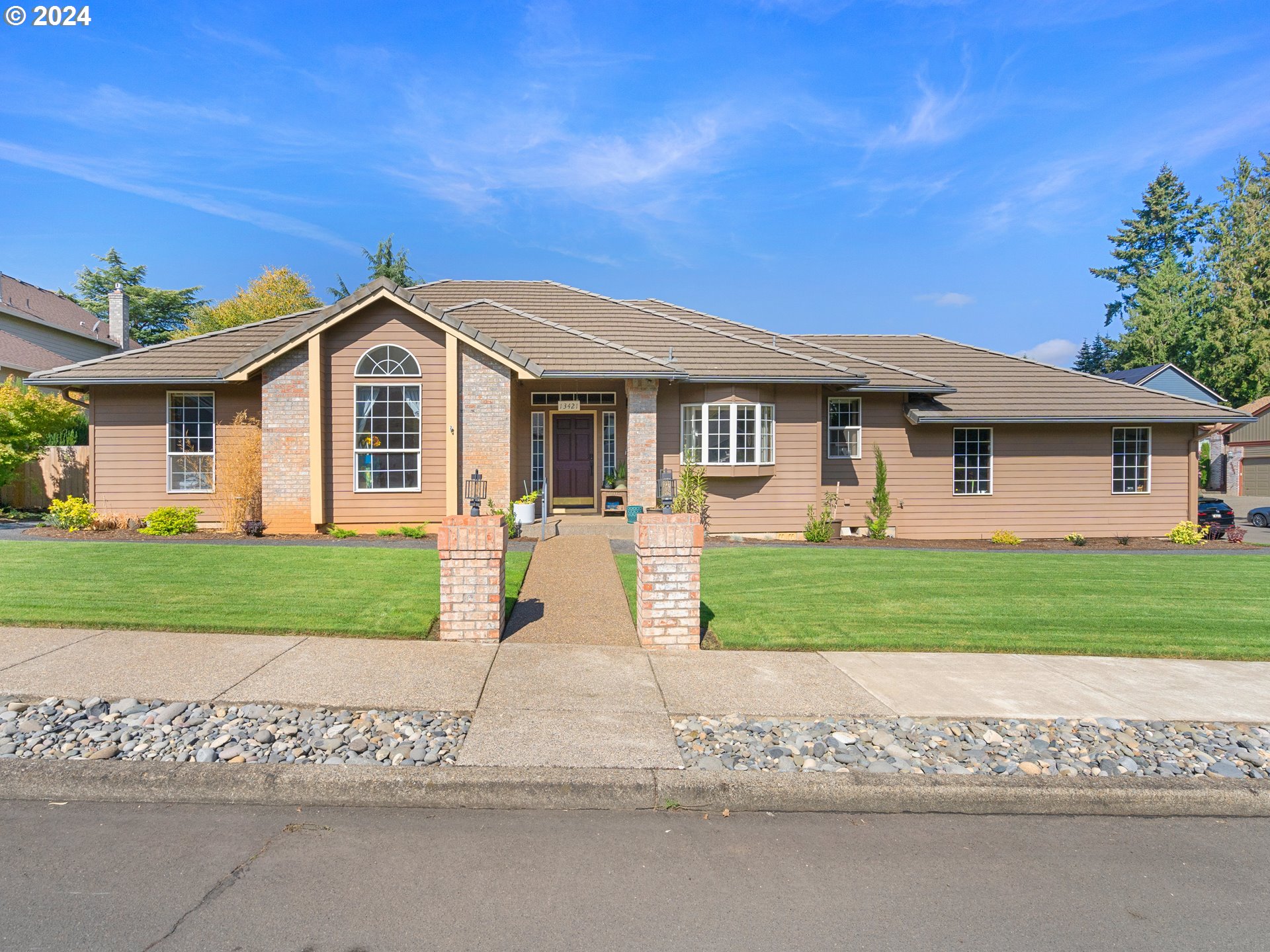 a front view of a house with a yard