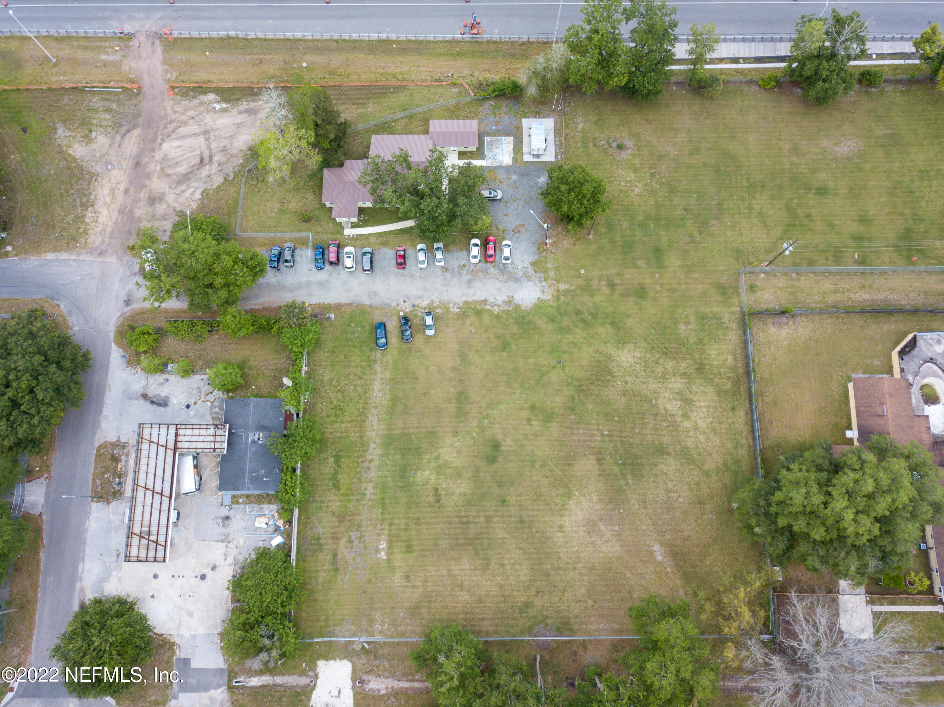 an aerial view of residential house with outdoor space and lake view