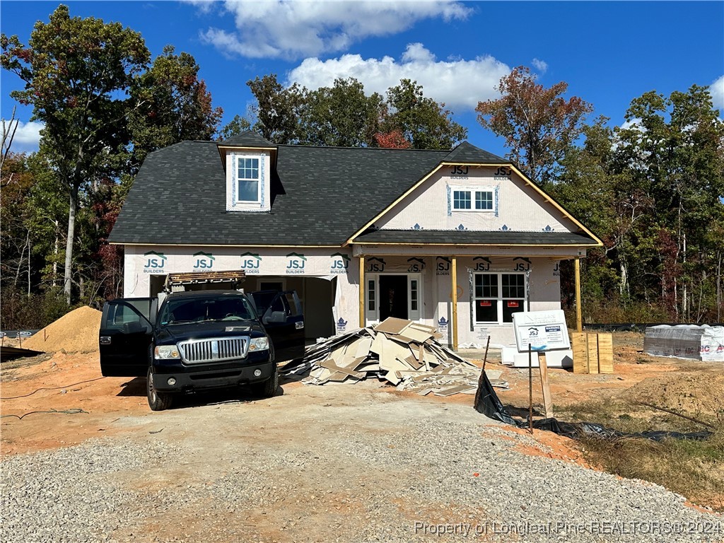 a view of a car park in front of house