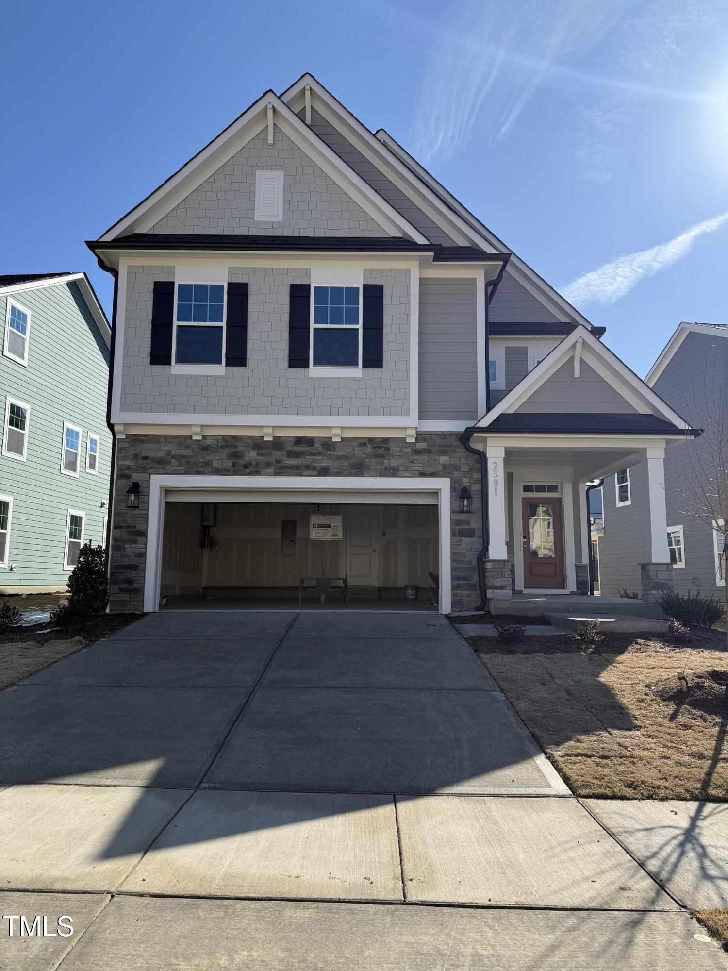 a front view of a house with yard