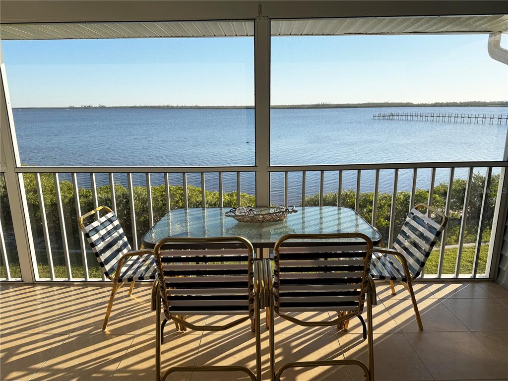 a view of a balcony with chairs