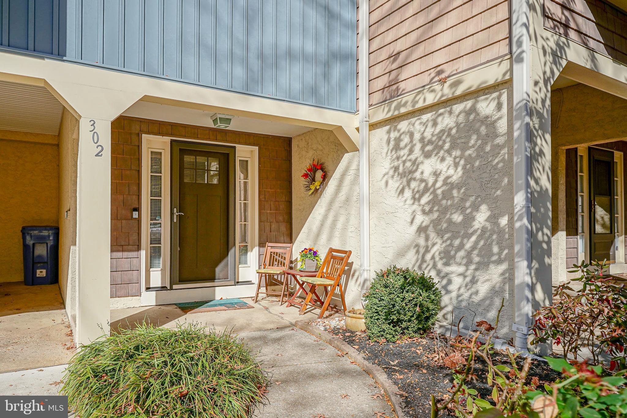 a view of a front door and wooden door