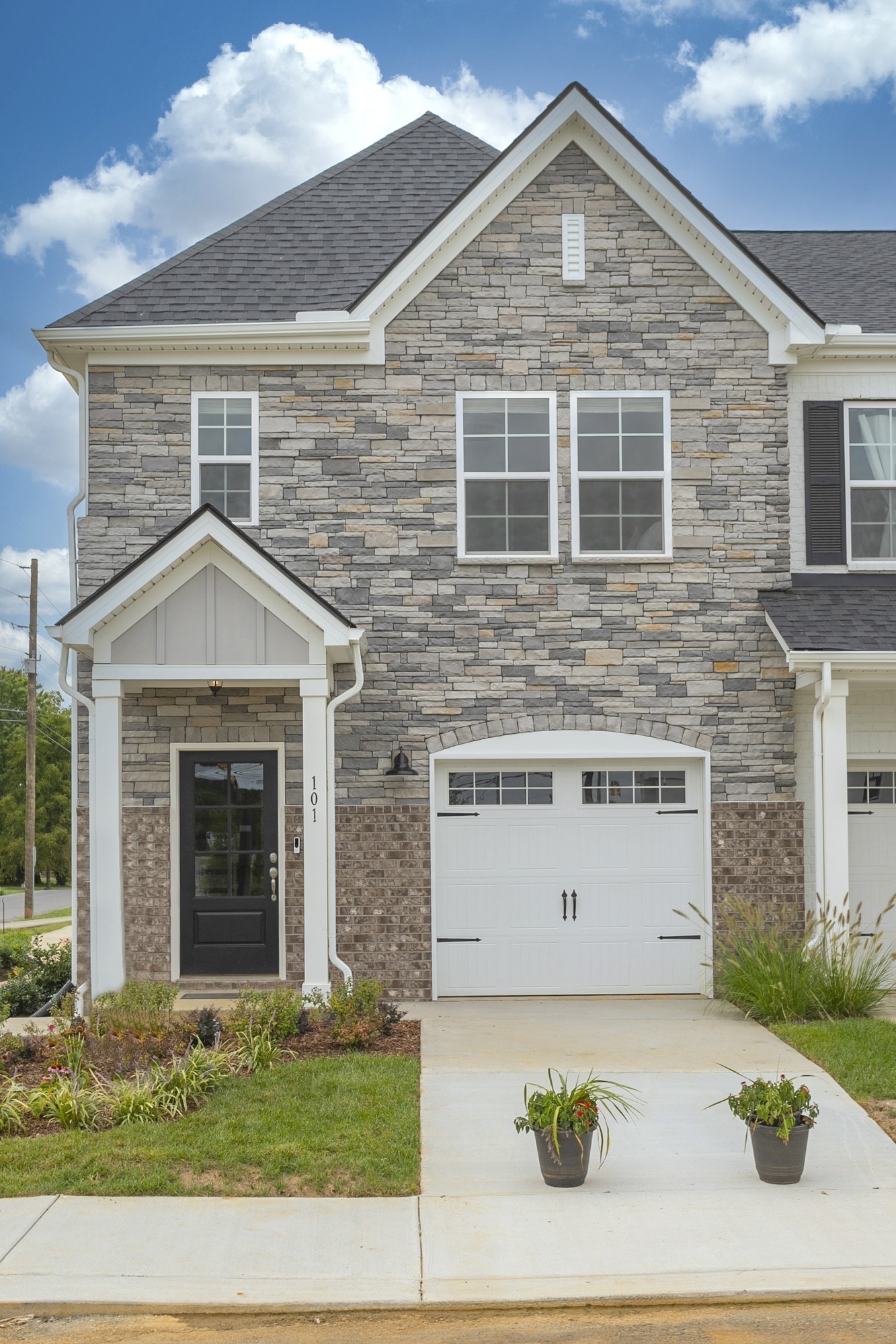 a front view of a house with garage