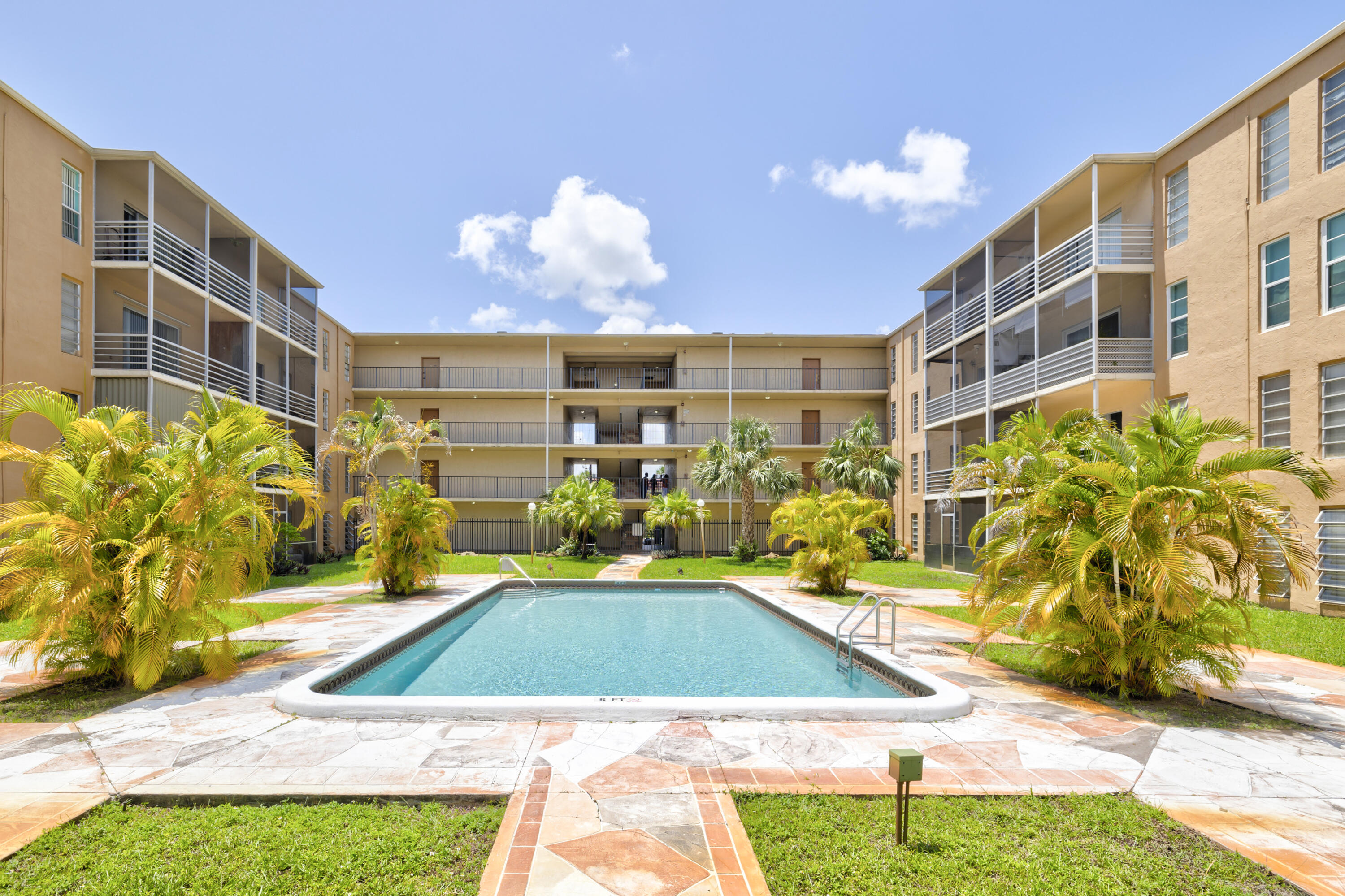 a view of a swimming pool with a patio