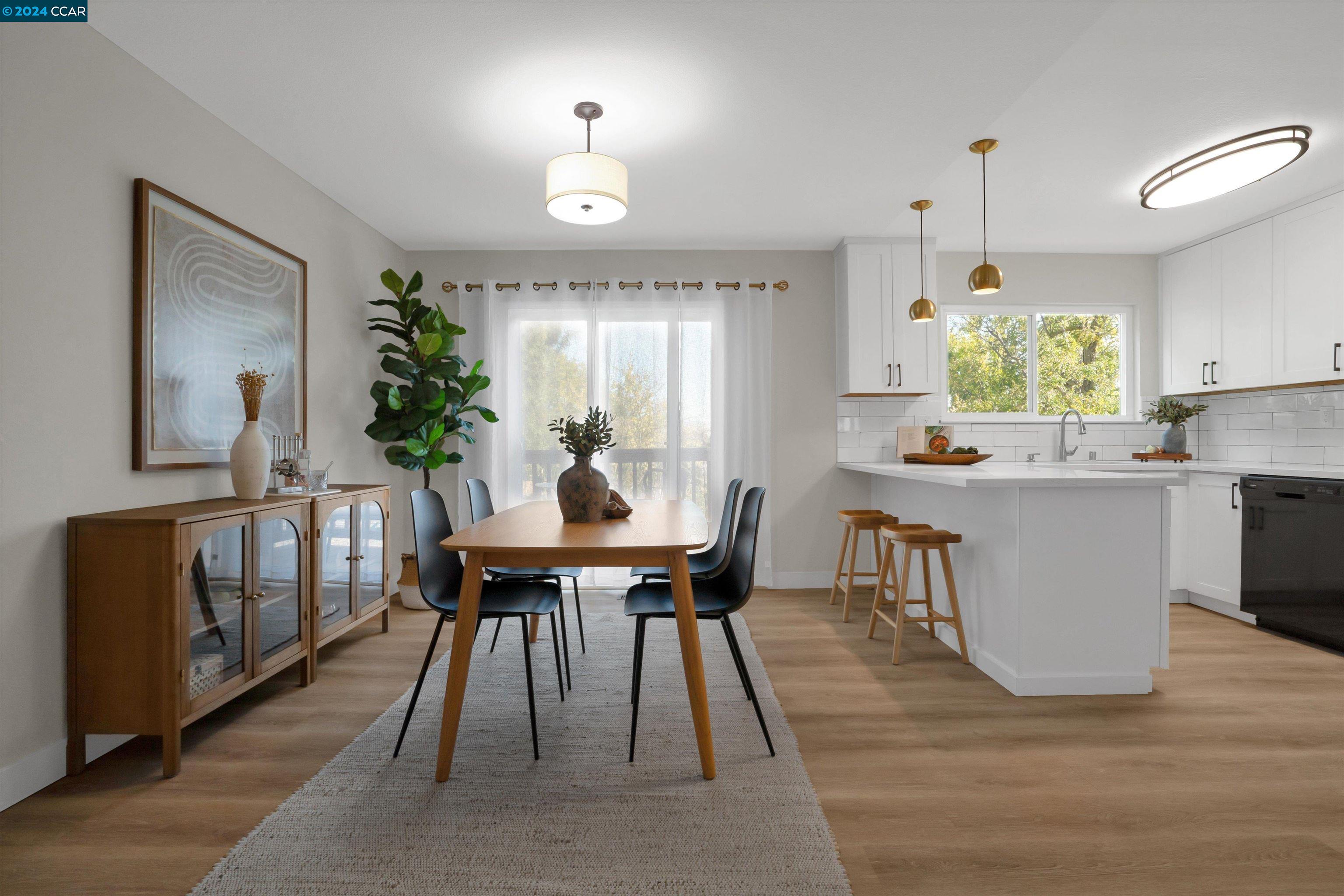 a view of a dining room with furniture and window