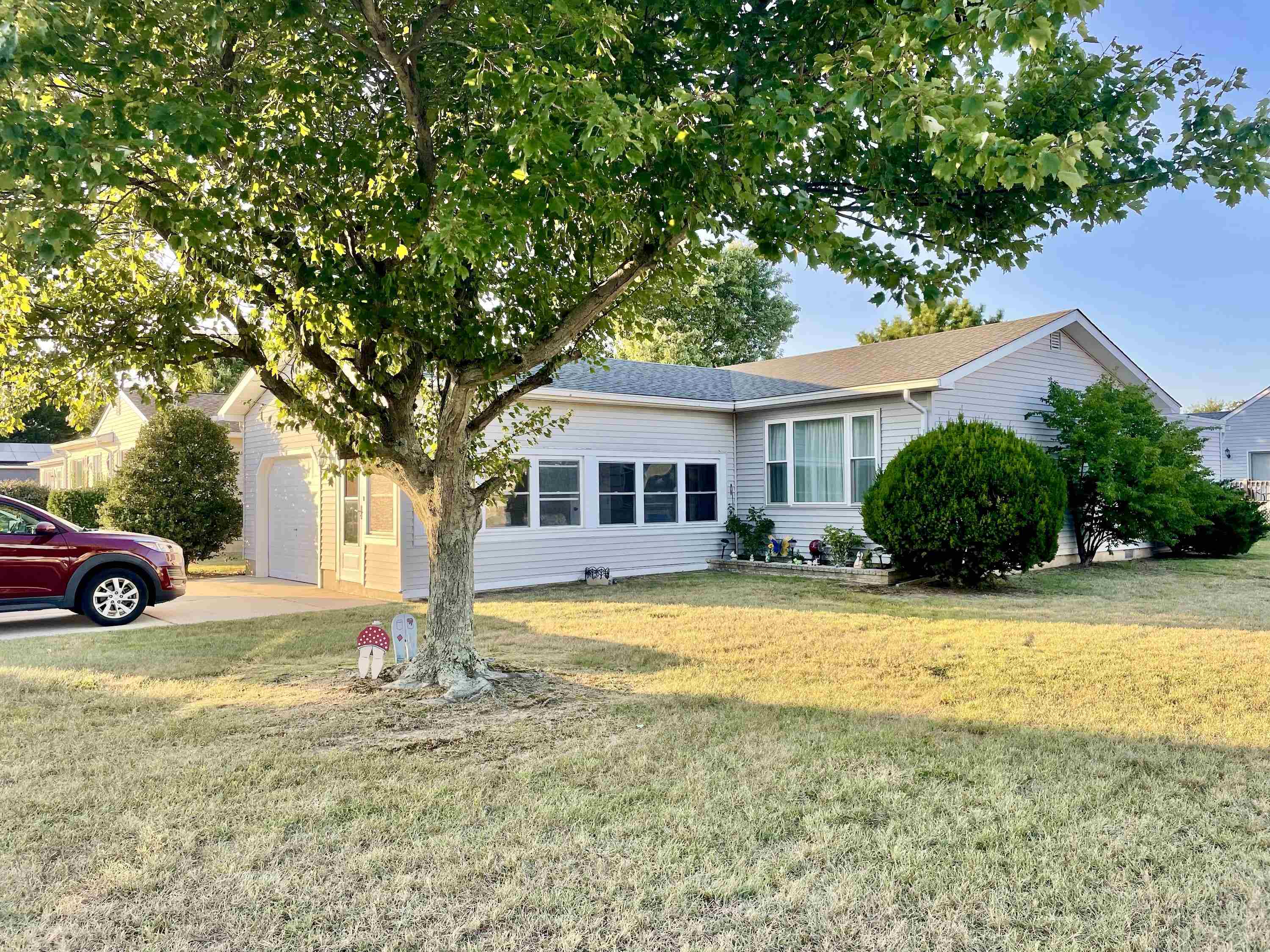 a view of a house with a yard